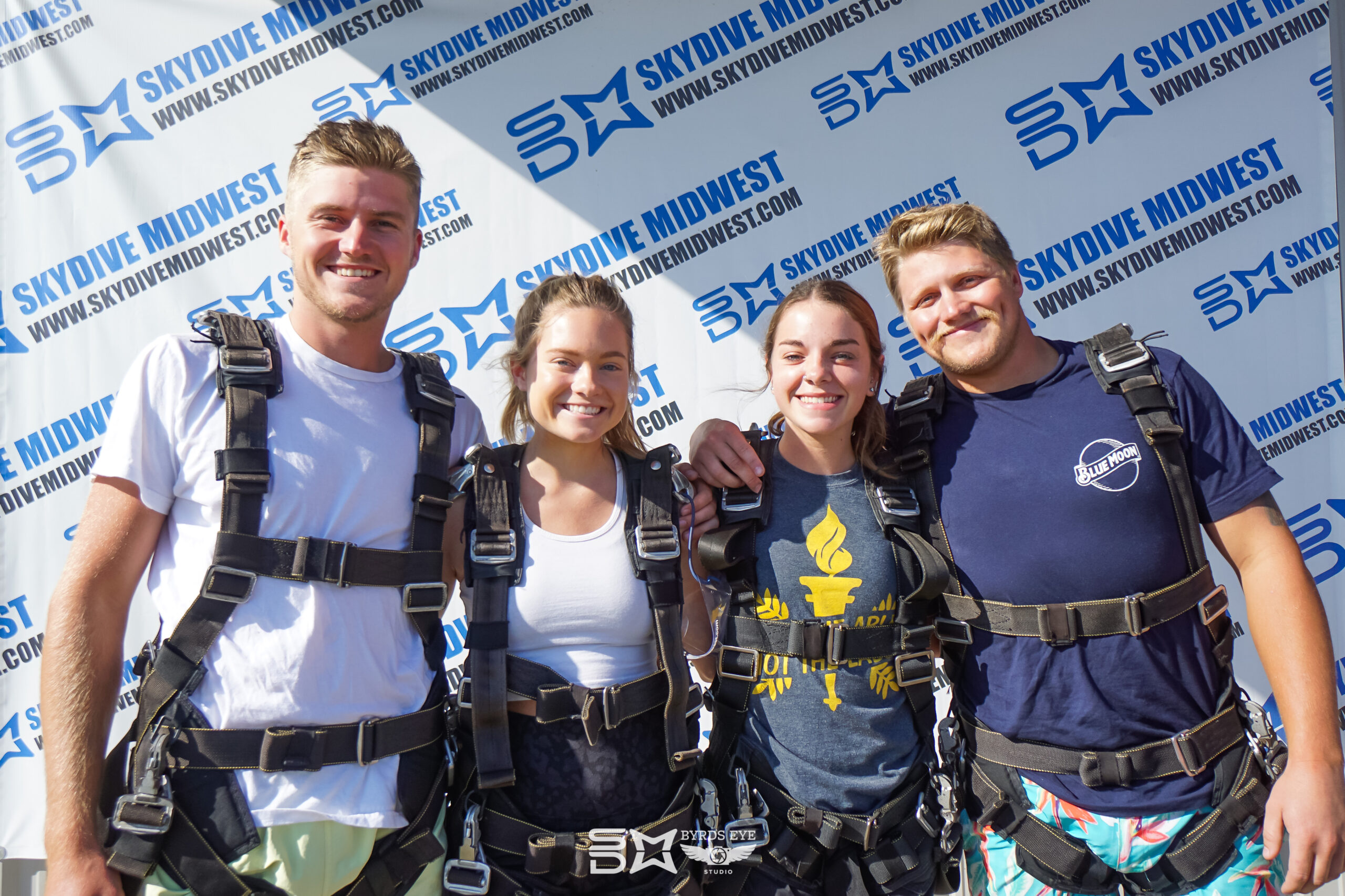 Tandem Skydivers pose for a picture before skydiving.