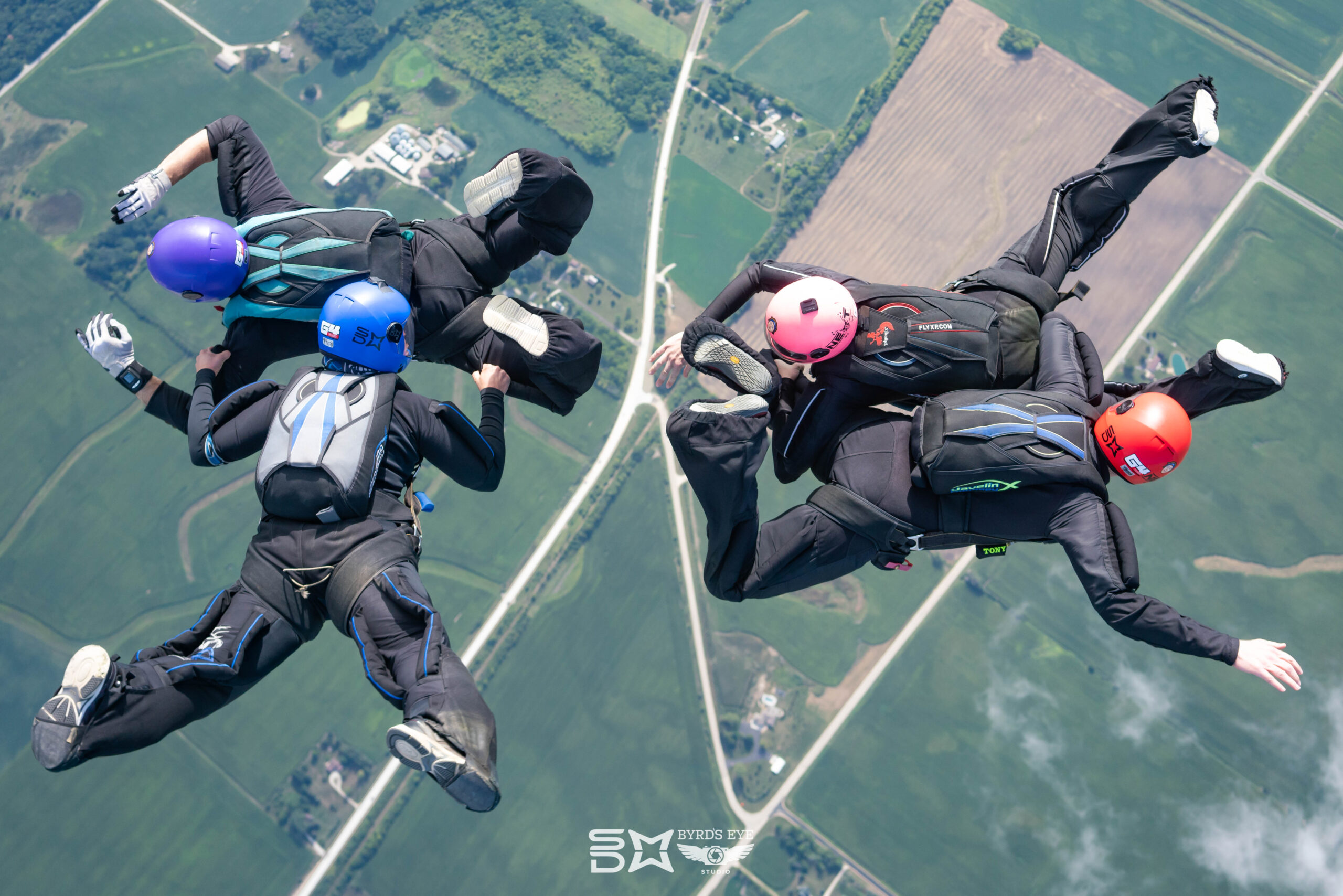 skydivers performing formation skydive maneuvers.