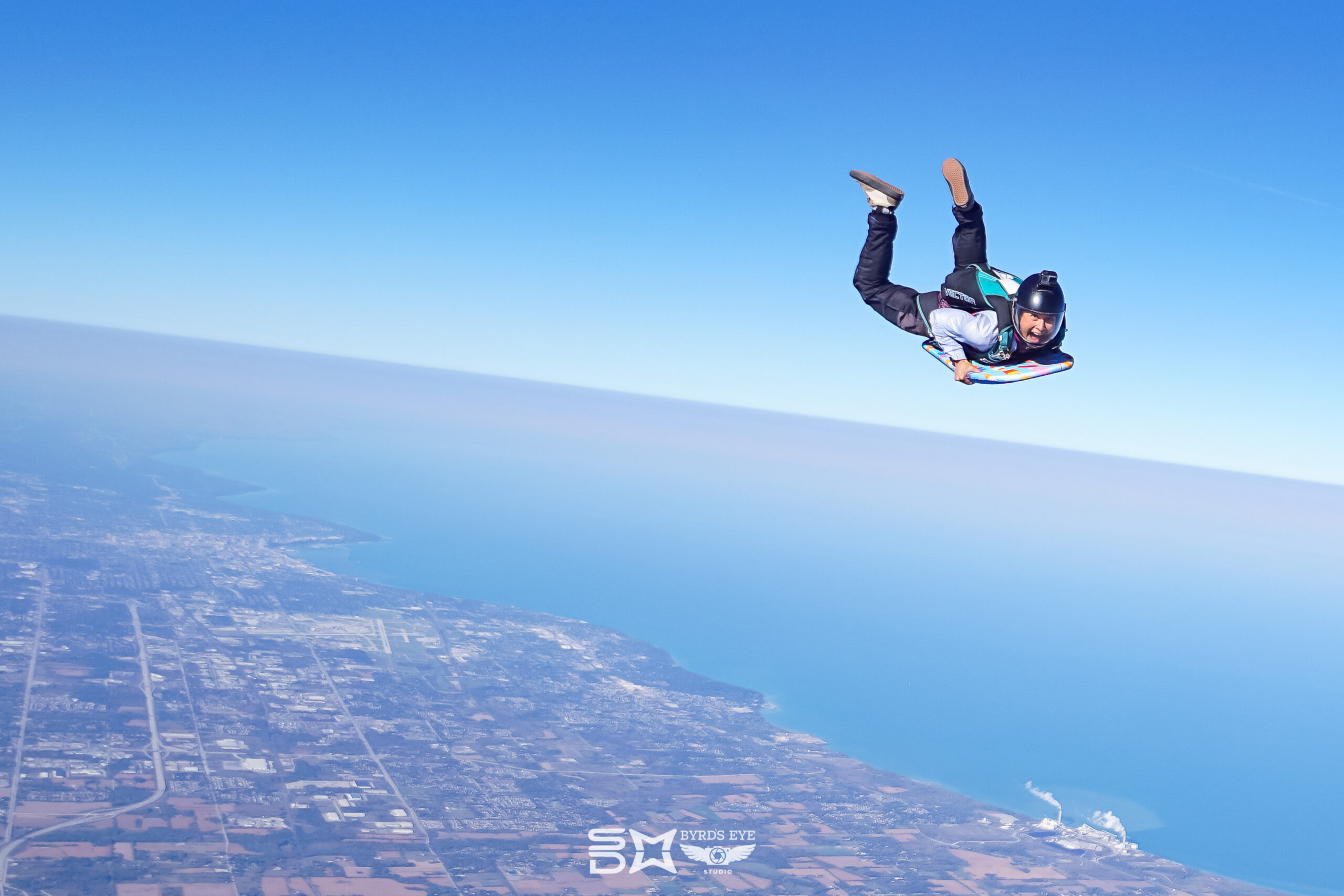 professional skydiving jumping over lake Michigan