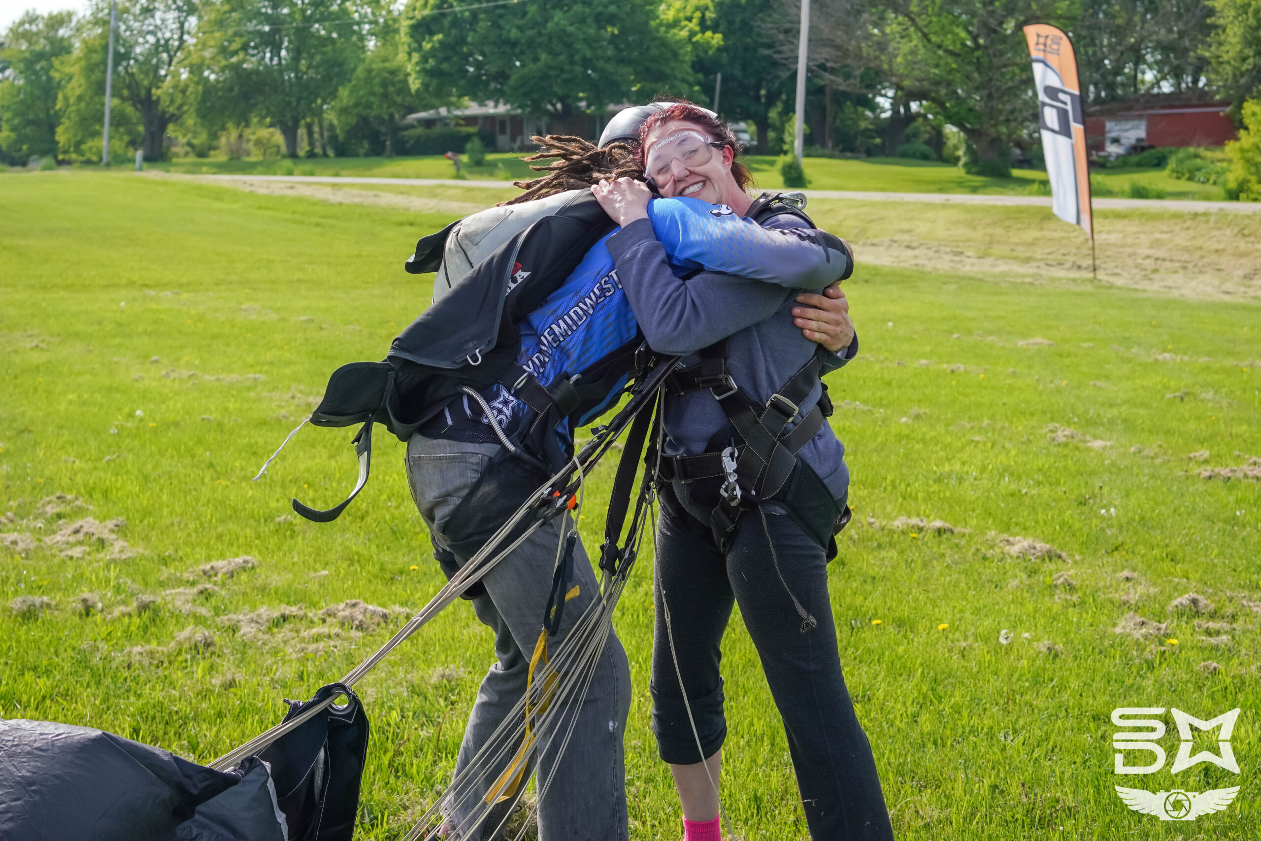 Tandem Skydiving Student Hugging Instructor