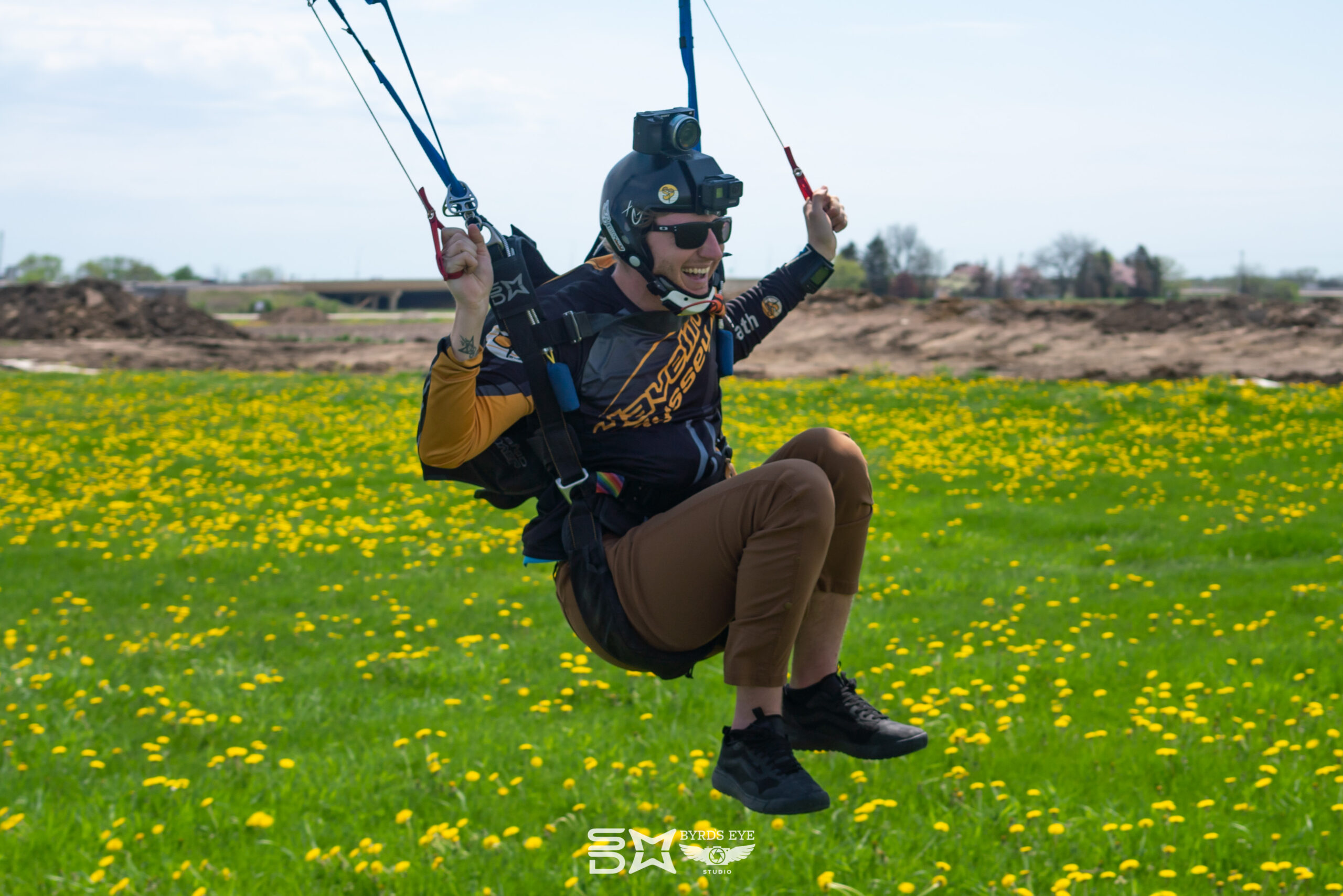 Austin George flying a parachute