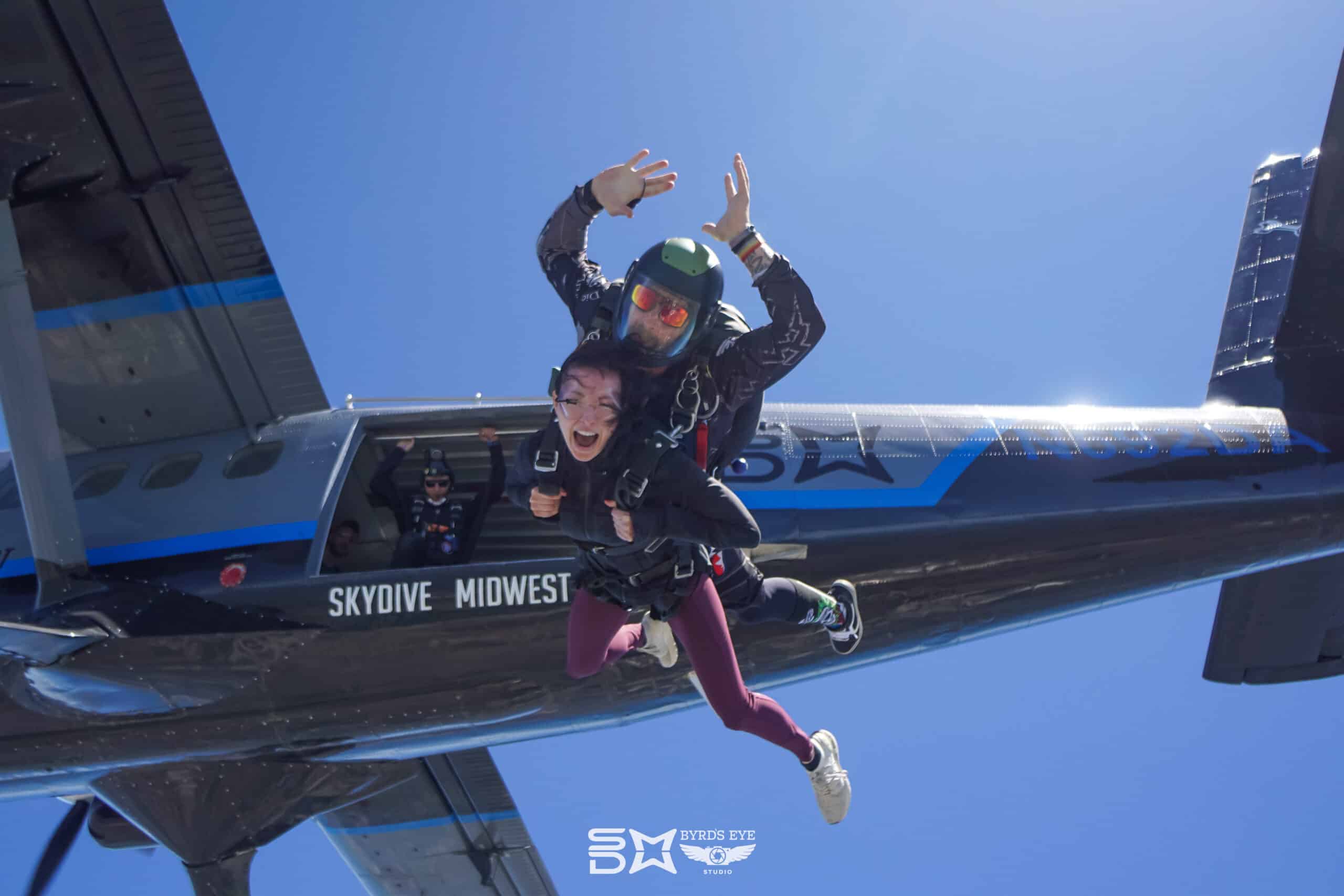 Tandem pair exiting the Skydive Midwest Plane