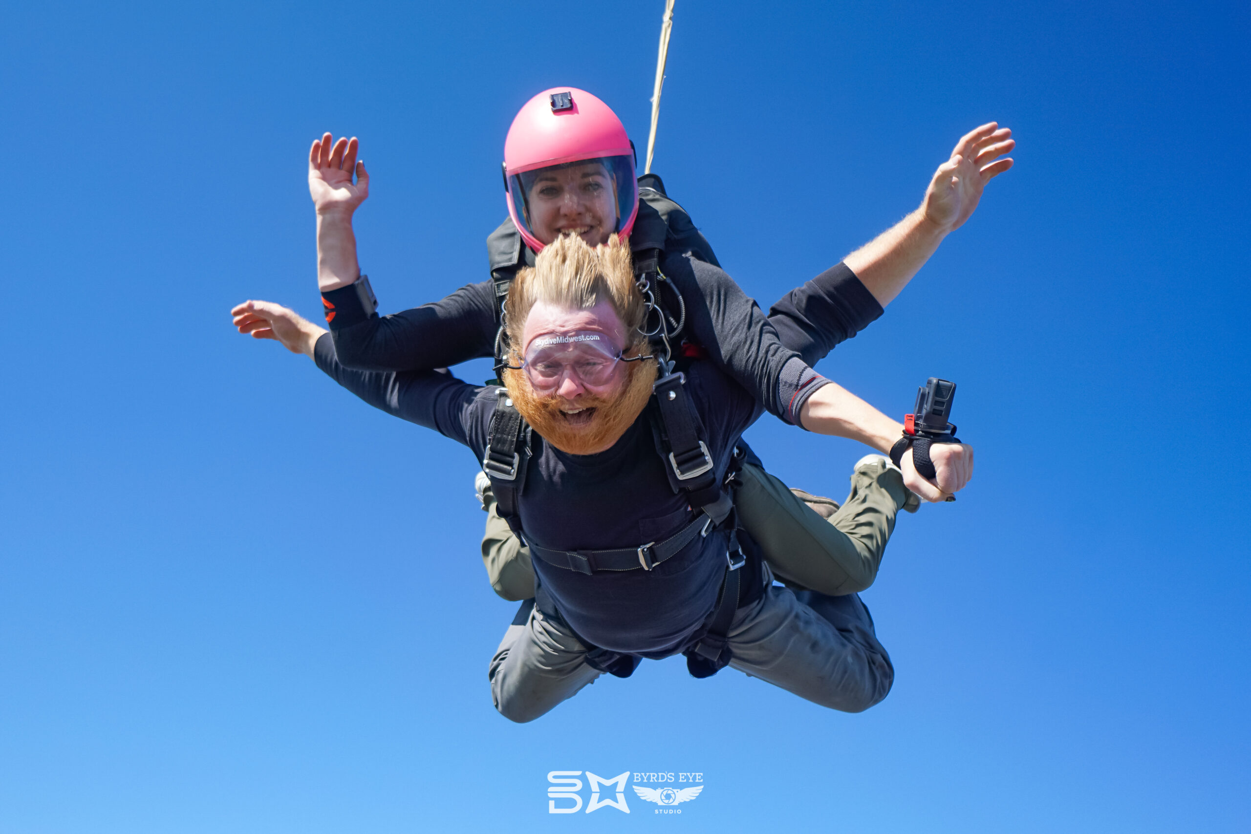 tandem student smiles during a skydive